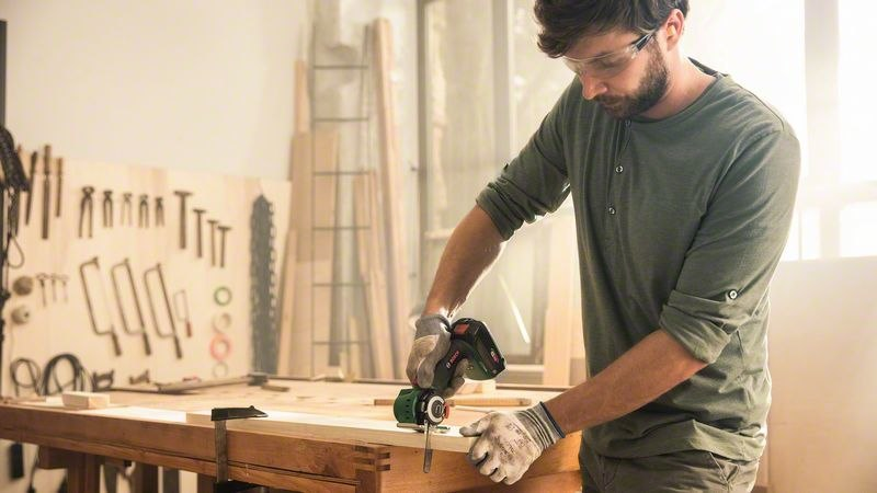 hobbyist, workbench, woodworking, powertool, man with drill